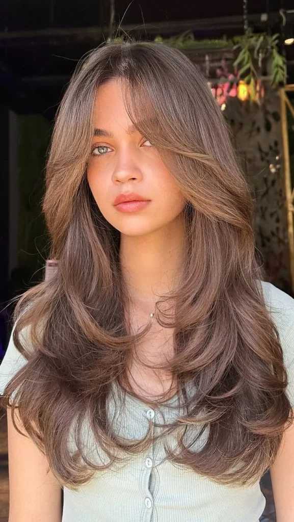 Stylish butterfly haircut with curtain bangs for women in their 30s