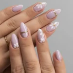 Lavender floral nail art with gold accent design creating a stylish look