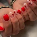 Colorful ladybug nail designs showcasing playful and modern styles for 2026.