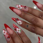 Elegant spring nail designs featuring floral patterns and vibrant colors