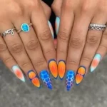Colorful mix and match nail designs featuring various styles and patterns