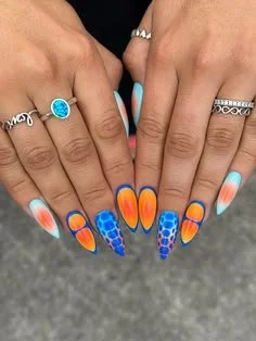 Colorful mix and match nail designs featuring various styles and patterns