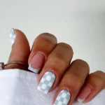 Creative blue checkered nails design with elegant French tips for moms.