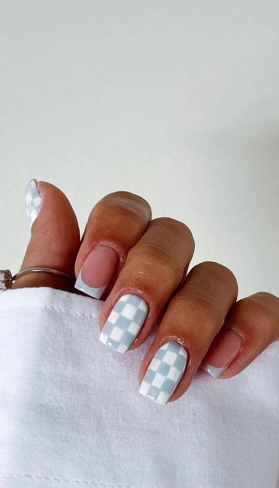Creative blue checkered nails design with elegant French tips for moms.