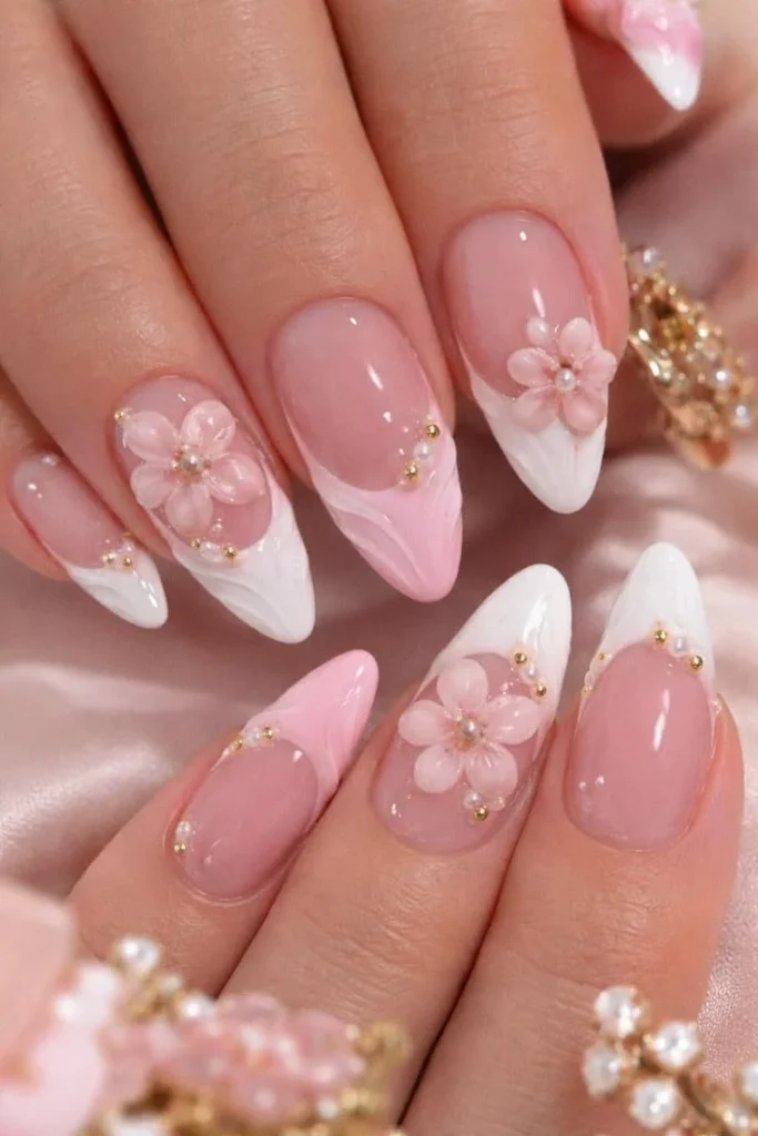 Close-up of shiny white French tips on beautifully manicured nails.