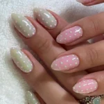 Spring 2026 nail art trends showcasing sequined floral designs and mob wife inspiration.