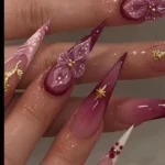Colorful stiletto nails showcasing bold and eclectic designs.