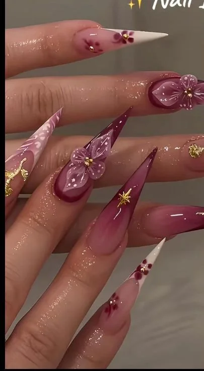 Colorful stiletto nails showcasing bold and eclectic designs.