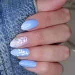 Beautiful blue nails showcasing a trendy manicure for moms