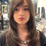 Stylish wolf cut hair with layered textures and volume.