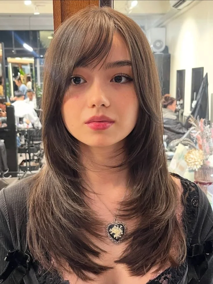 Stylish wolf cut hair with layered textures and volume.