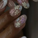 Colorful back to school nail art featuring cute flower designs for girls.