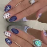 Elegant blue and white nails showcasing a trendy color combination.