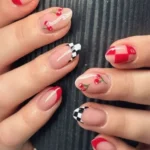 Elegant checkered nails featuring French styles and cherry red designs.