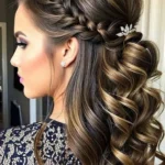 Bridal hair inspiration featuring a beautiful fishtail braid and half-up hairstyle.