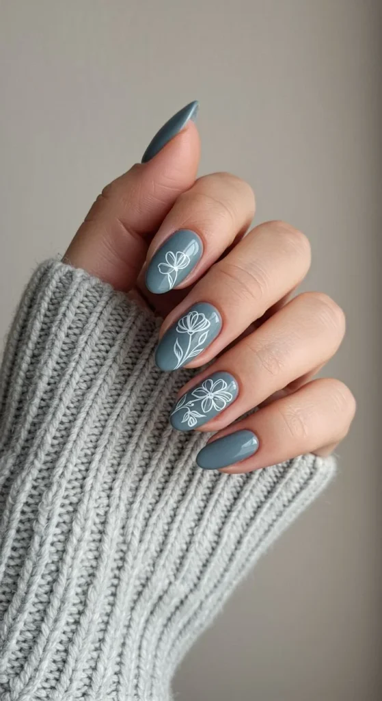 Elegant grey nails design featuring minimalist white flowers