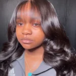 Curly hairstyles for black women featuring curls with bangs and quick weave styles.