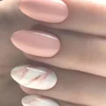 Pink marble effect gel nails for young ladies showcasing elegant nail art design.