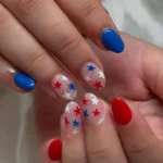 Patriotic 4th of July nails with red, white, and blue designs for festive celebration