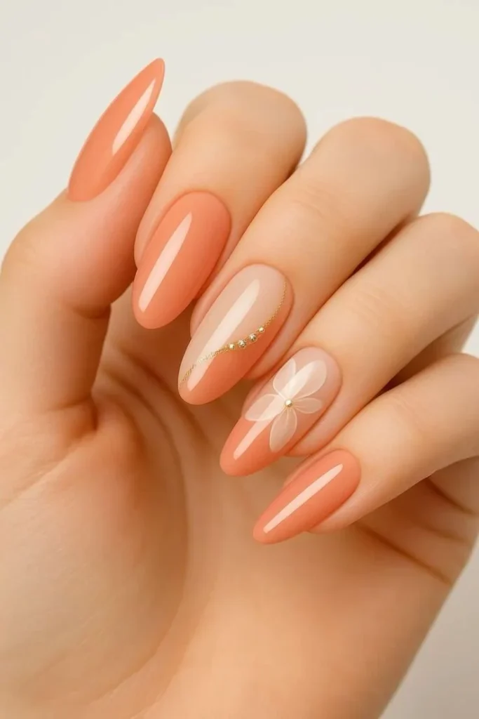 Short acrylic summer nails with pink floral design and peach accents.
