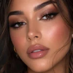 Soft glam makeup look featuring bold eyes and glossy lips for moms