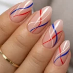Elegant 4th of July nail designs with fireworks and patriotic colors