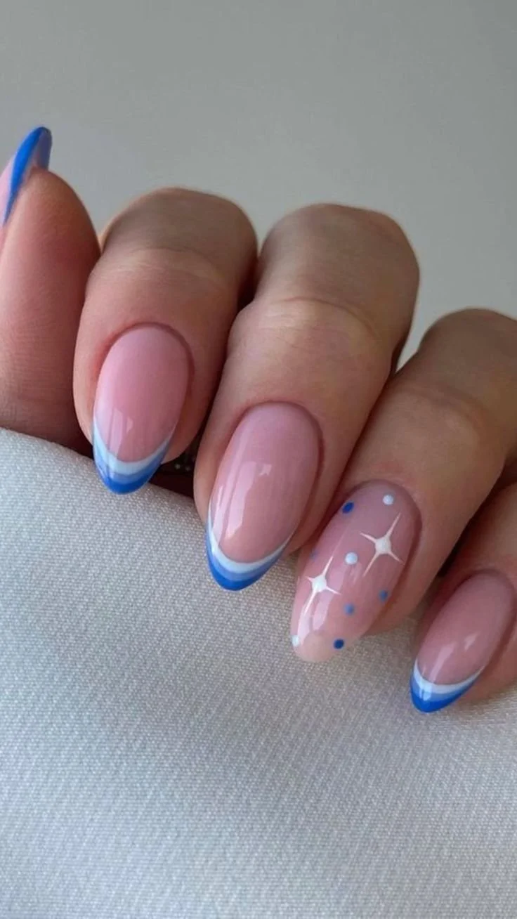 Festive blue star nails design for Christmas manicure inspiration.