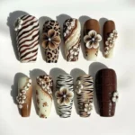 Brown animal print press on nails with zebra and leopard patterns, 3D floral design.