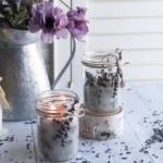 Homemade lavender candles in decorative jars for DIY decor.