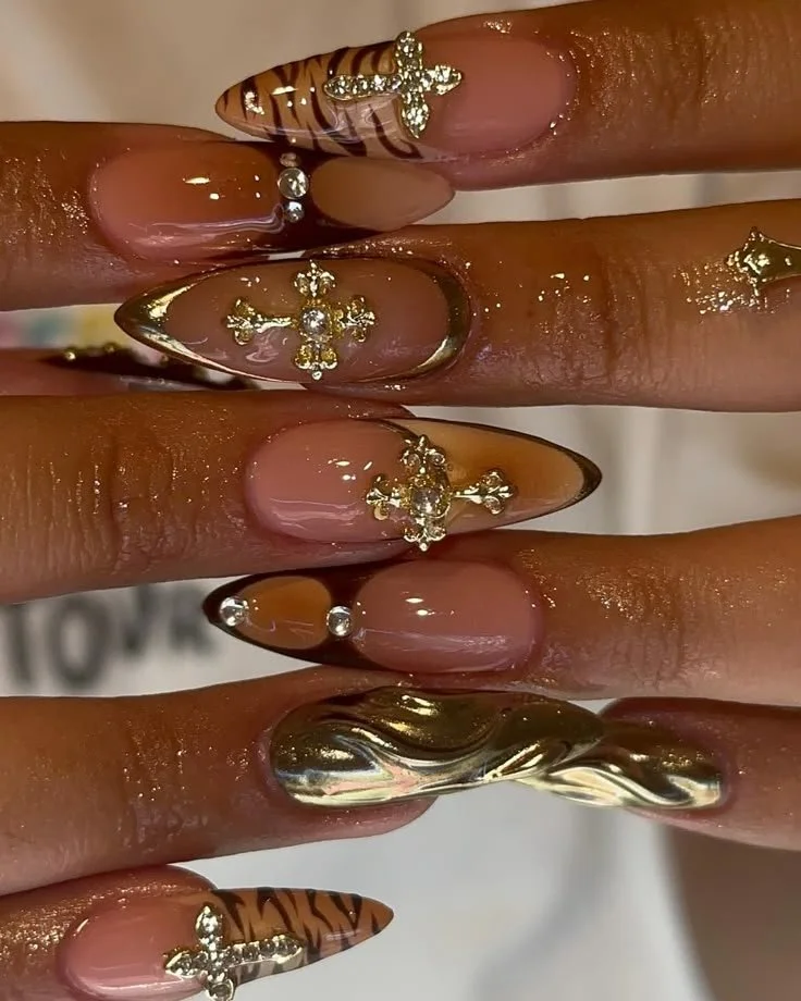Chic nails featuring gold cross design and cheetah print for busy moms.