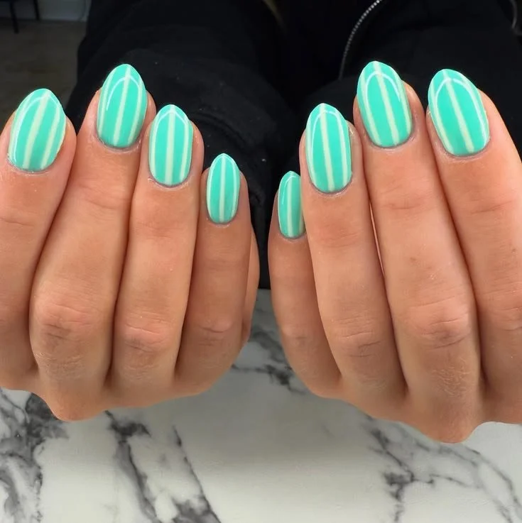 Teal and striped beach nails design ideas for a summer cruise vacation