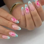 Pastel French tips with pink floral nail art design for busy moms