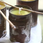 Homemade citronella candles for outdoor use to repel bugs and create a peaceful atmosphere.
