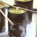 Handmade DIY citronella candles for outdoor use on a summer evening.