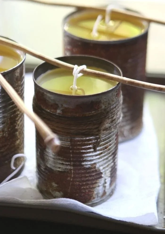Handmade DIY citronella candles for outdoor use on a summer evening.