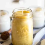 Homemade beeswax candles displayed on a wooden table