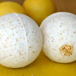 Lemon Vanilla Bath Bomb fizzing in water for a relaxing bath experience