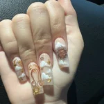 Stylish and vibrant Leo nails design inspired by zodiac signs.