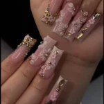 Close-up of beautifully manicured nails showcasing the latest nail art trends.