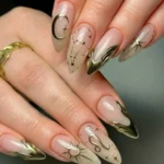 Playful hand-painted Leo birthday nails for kids' celebrations