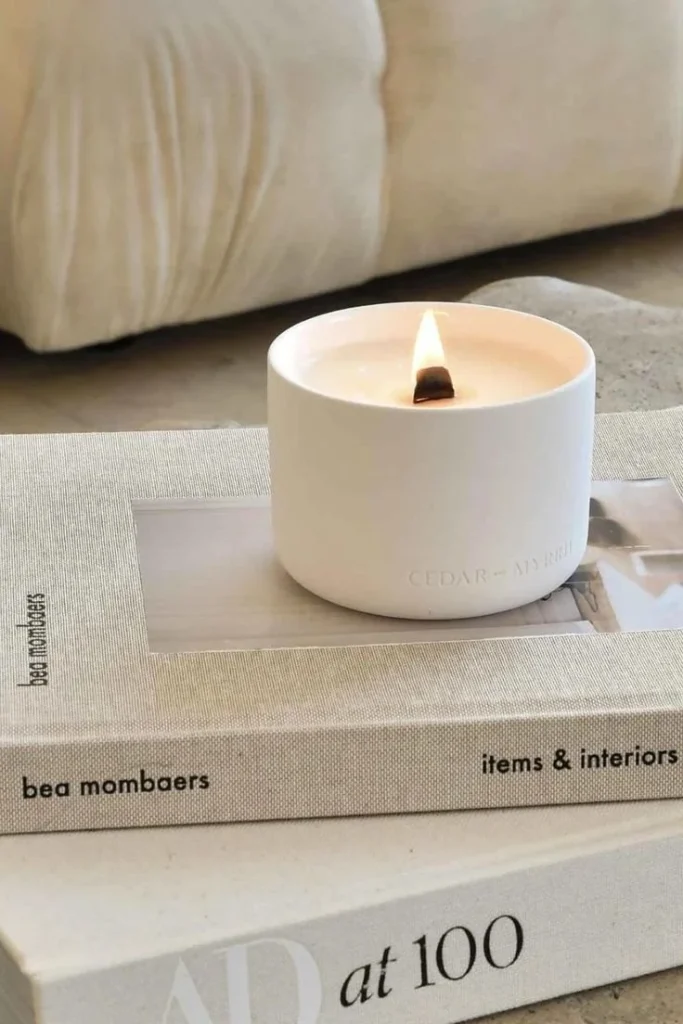 Wellness candle used in quick deep breath rituals for busy moms