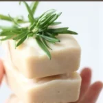 Homemade goat milk soap bars in a rustic setting