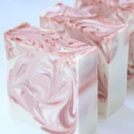 Beautiful array of handmade cold process soaps showcasing various colors and scents.