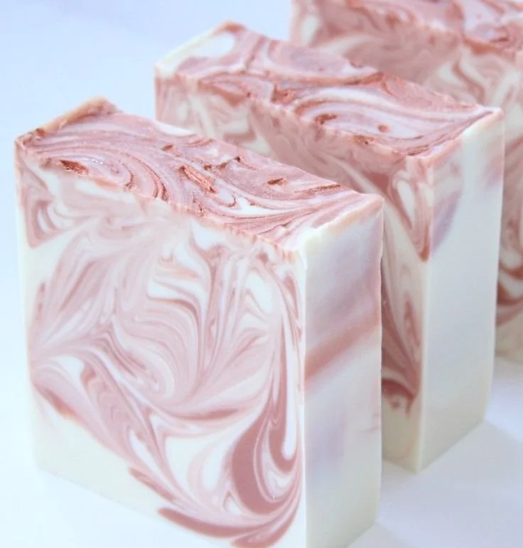 Beautiful array of handmade cold process soaps showcasing various colors and scents.