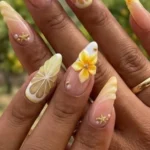 Tropical inspired almond shape nails with vibrant colors and designs