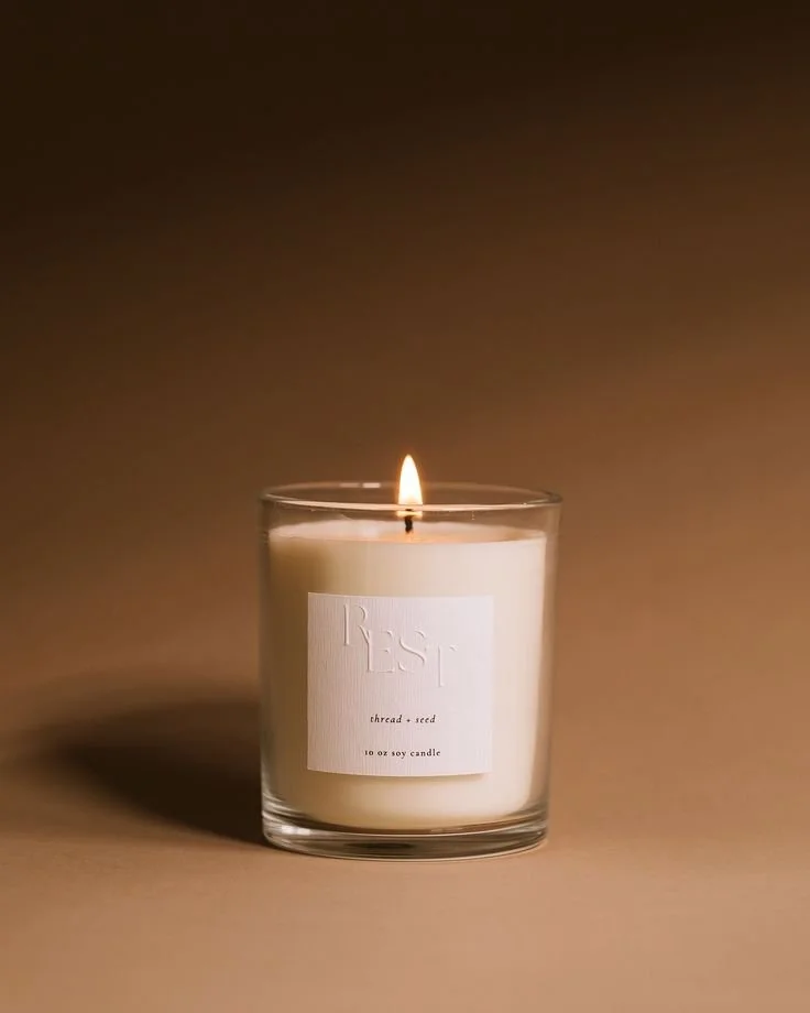 The Rest Candle by Thread + Seed helps moms achieve better sleep.