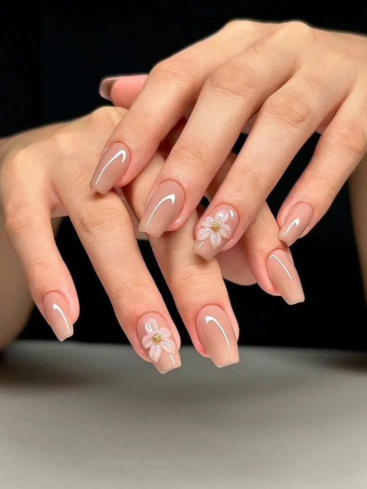 Simple coffin nail ideas featuring soft nude manicure styles
