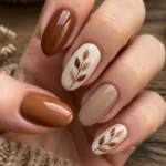 A variety of beautiful fall theme nails featuring autumn colors and designs.