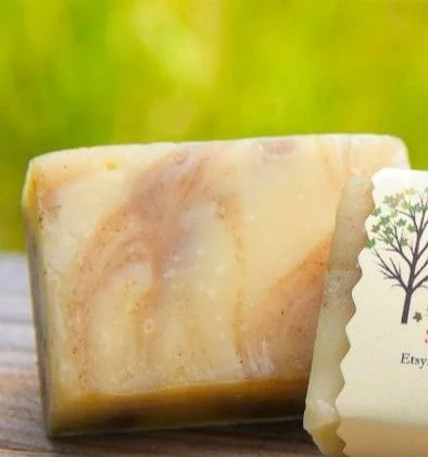 Homemade apple cider soap bar with autumn leaves and spices