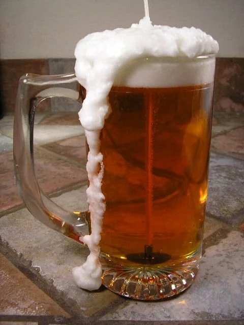 Beer gel and wax candle in a glass, showcasing rich root beer scent.